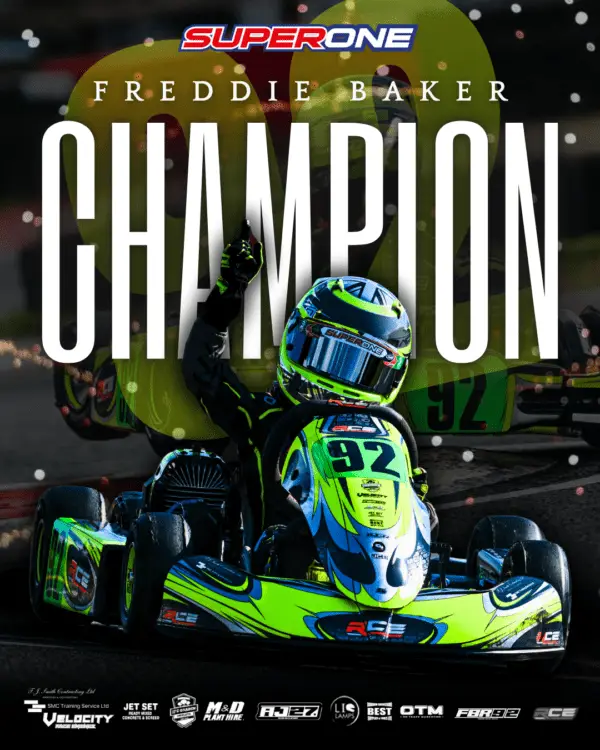 a person in a helmet on a go kart
