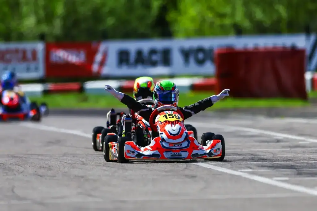 picture of alfie mair crossing the line in first at wackersdorf karting for the rmc