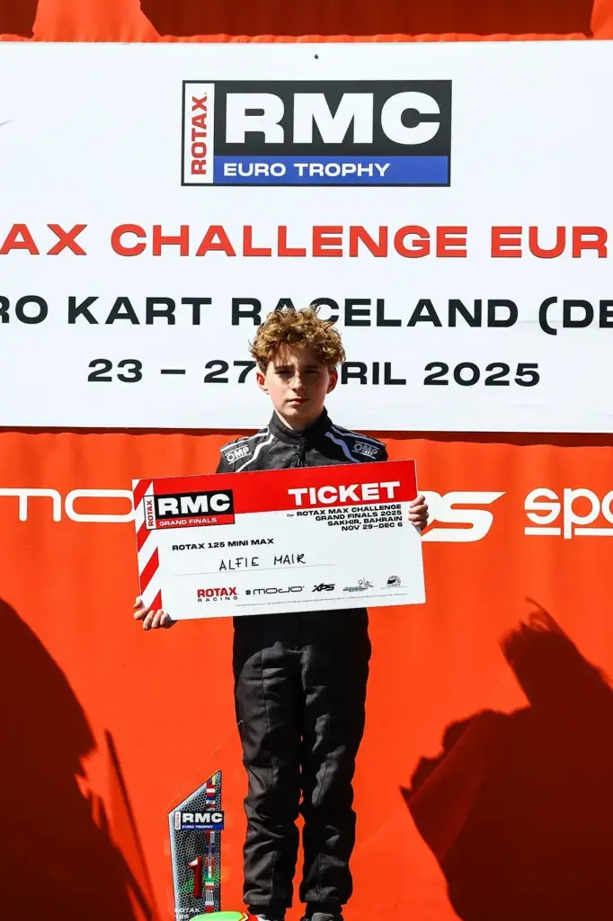 alfie mair holding his RMC Grand Finals Ticket.